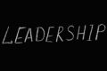 leadership lettering text on black background