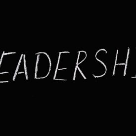 leadership lettering text on black background