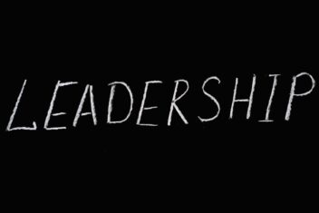 leadership lettering text on black background